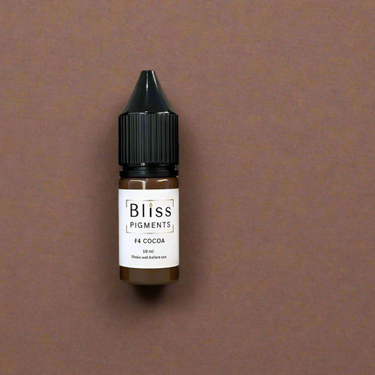 Set of six bottles of Bliss Pigments on a beige background